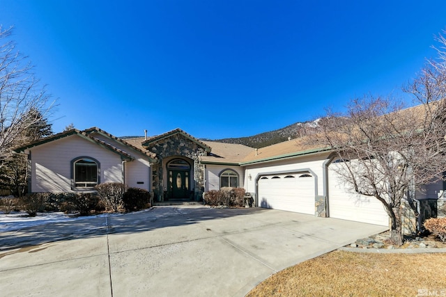 ranch-style home featuring a garage