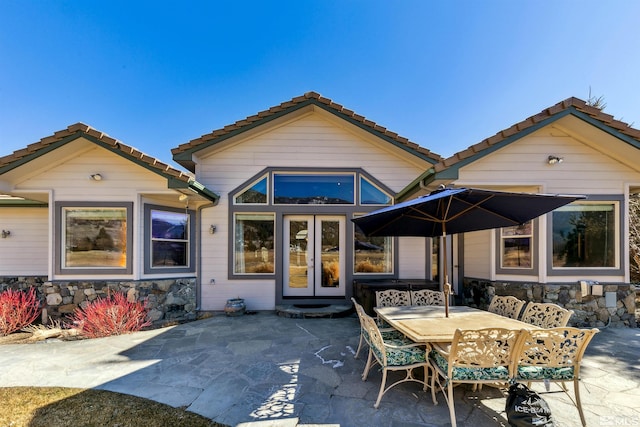 back of property featuring a patio area and french doors