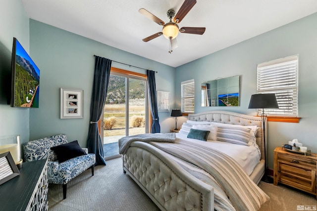 bedroom with access to exterior, light colored carpet, and ceiling fan