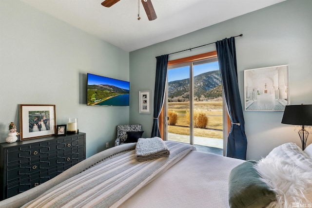 bedroom with access to outside and ceiling fan