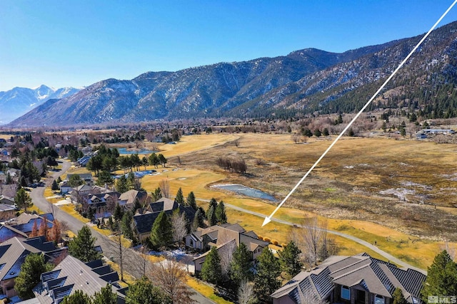 birds eye view of property featuring a mountain view