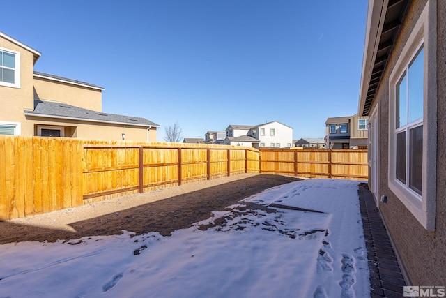 view of yard covered in snow