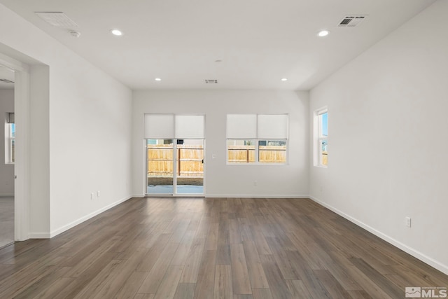 spare room featuring dark hardwood / wood-style flooring