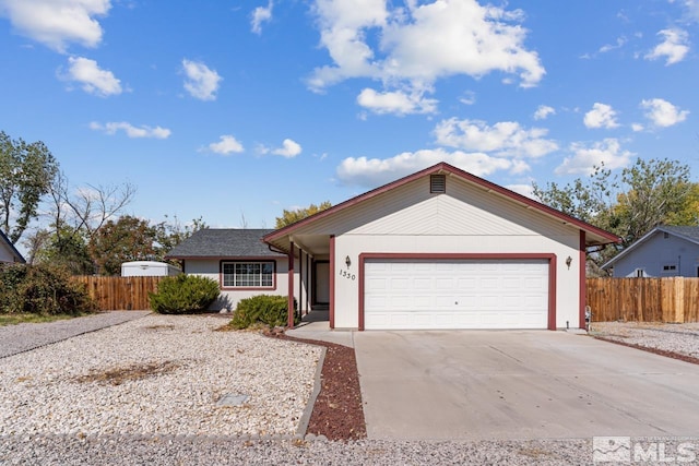 ranch-style home featuring a garage