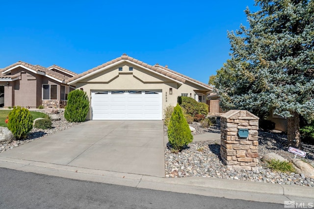 single story home featuring a garage