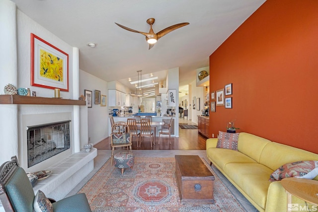 living room with vaulted ceiling and ceiling fan