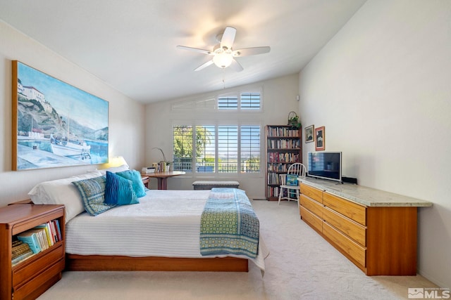 carpeted bedroom with ceiling fan and lofted ceiling