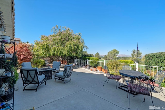 view of patio featuring an outdoor fire pit