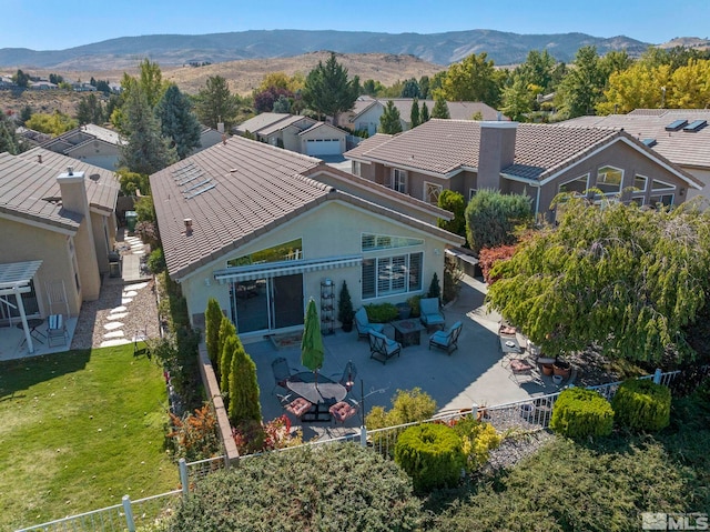 birds eye view of property featuring a mountain view