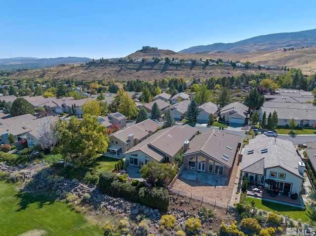 birds eye view of property featuring a mountain view