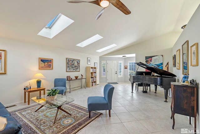 tiled living room featuring ceiling fan and lofted ceiling