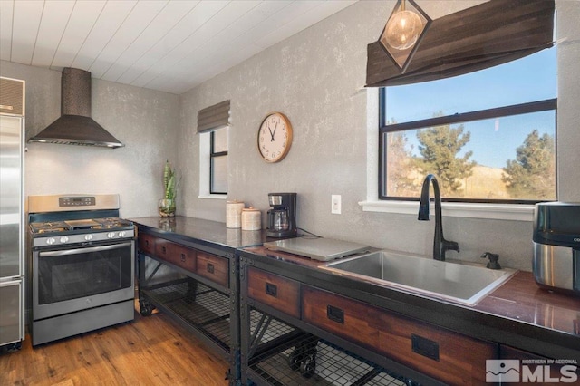 kitchen with sink, wood ceiling, stainless steel appliances, light hardwood / wood-style floors, and custom range hood