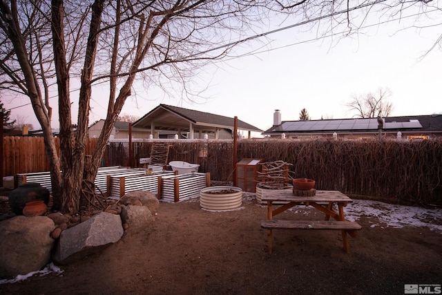 yard at dusk with a fire pit