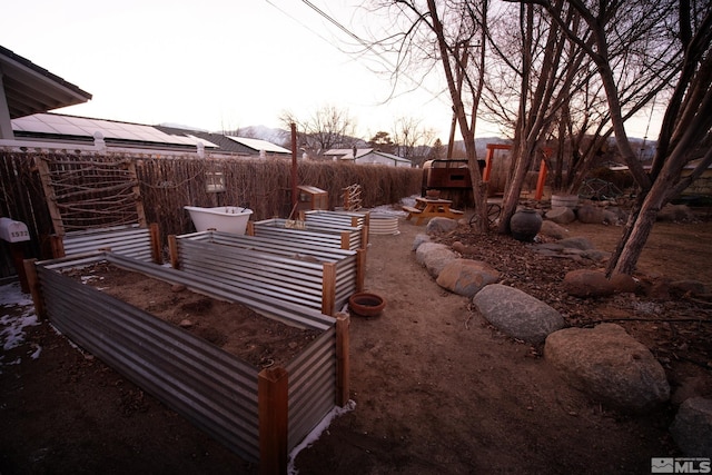 view of yard at dusk