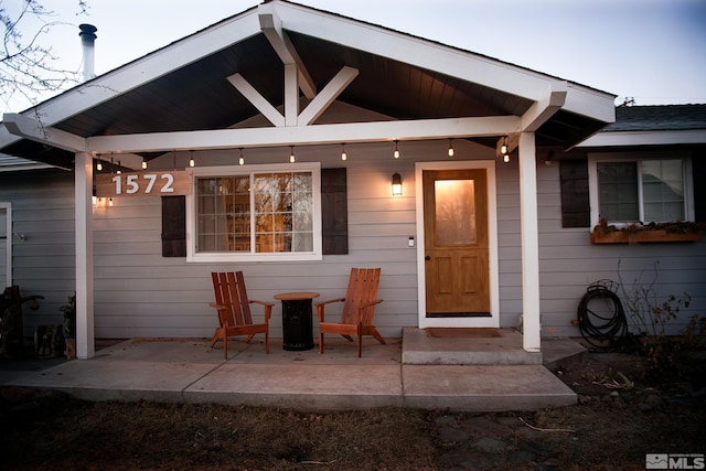 doorway to property with a patio