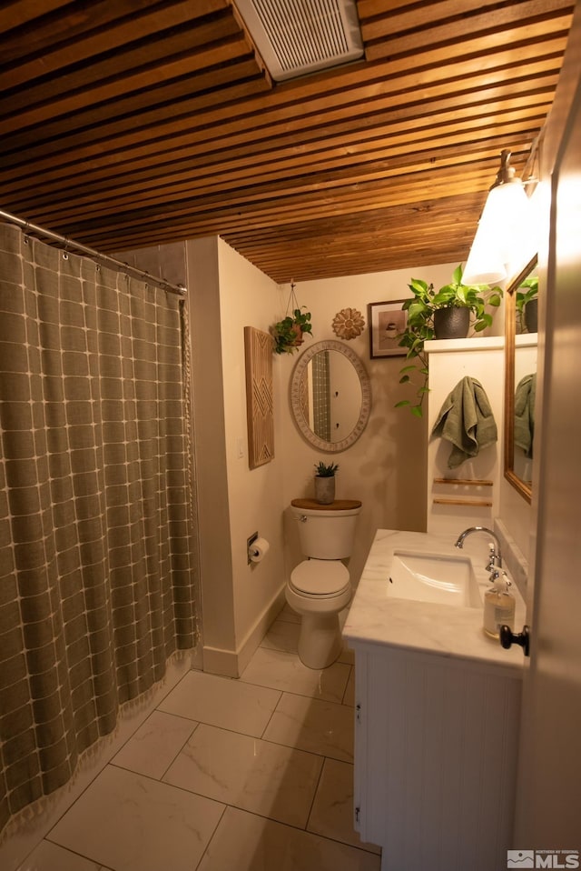 bathroom featuring vanity, curtained shower, and toilet