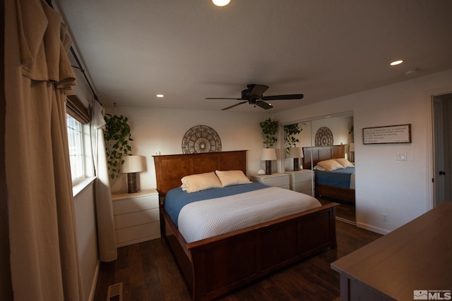 bedroom featuring ceiling fan and dark hardwood / wood-style flooring