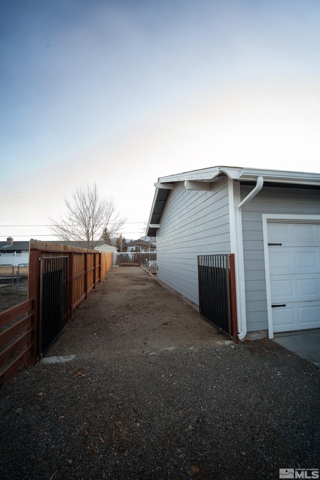 view of side of home with a garage