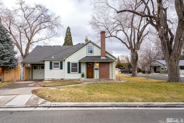 view of front facade featuring a garage and a front lawn