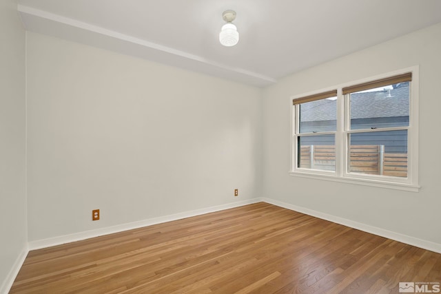 empty room featuring wood-type flooring