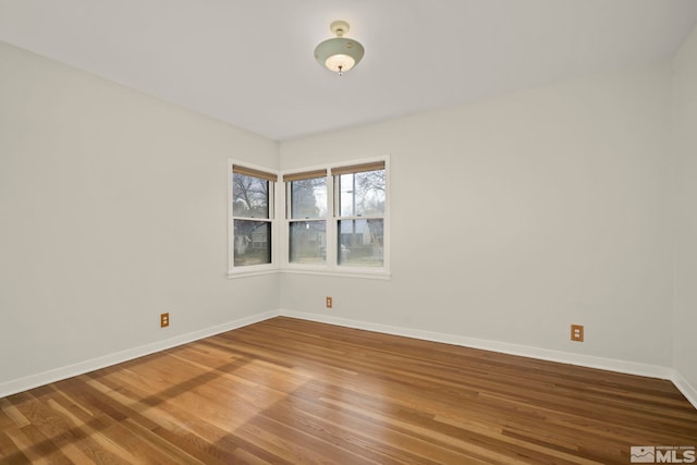 empty room featuring hardwood / wood-style flooring