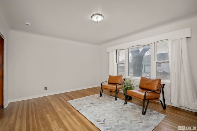 sitting room with light hardwood / wood-style floors