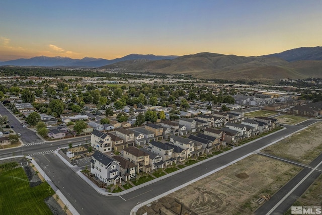 aerial view at dusk with a mountain view