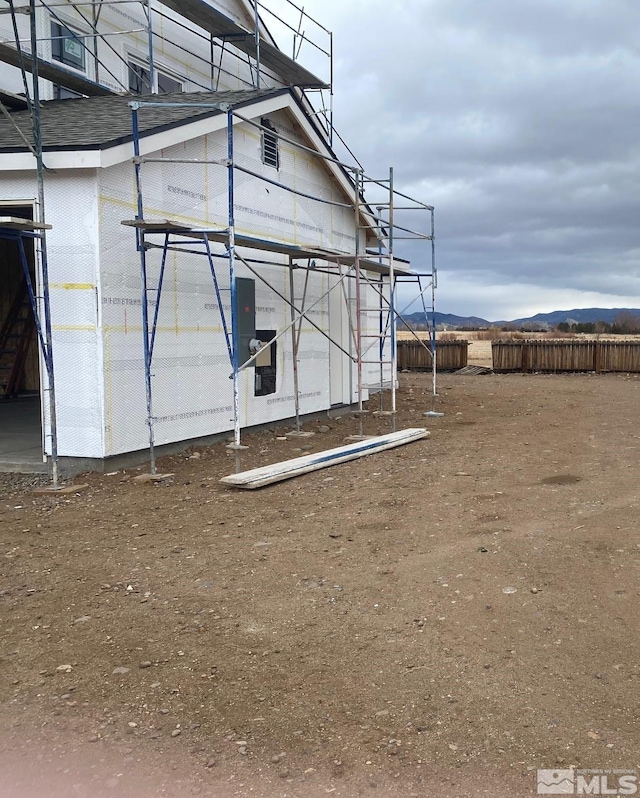 view of outbuilding featuring a mountain view