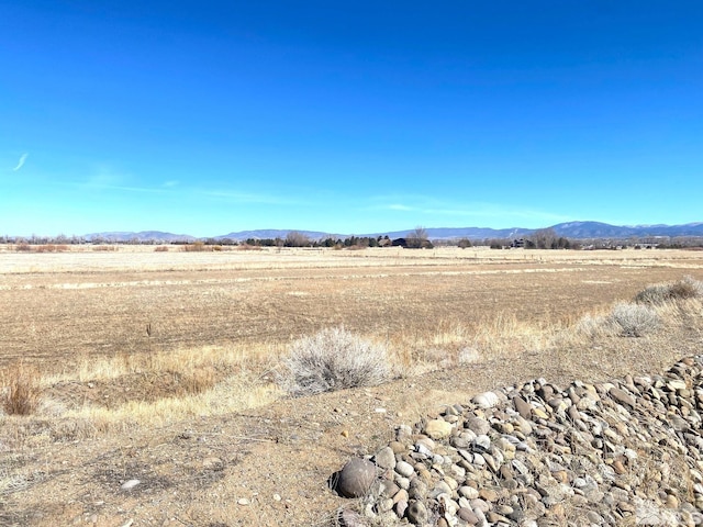 view of mountain feature with a rural view