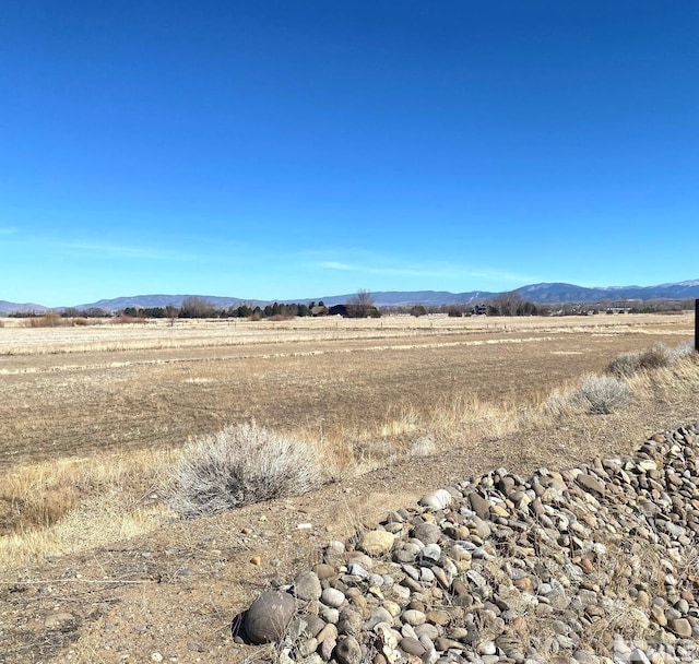 property view of mountains featuring a rural view