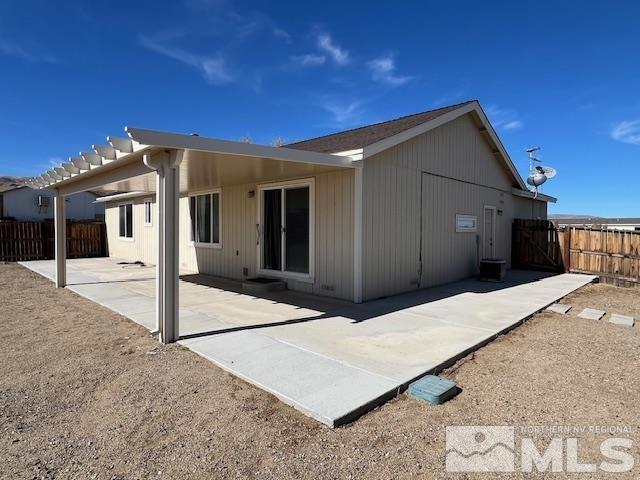 rear view of property featuring a patio area