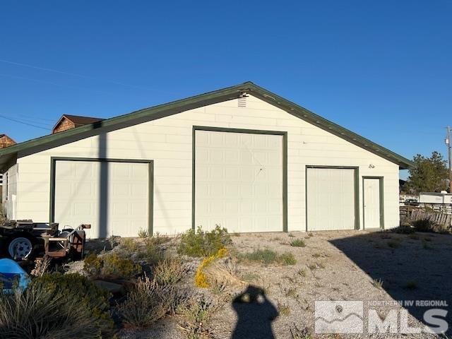 view of outdoor structure with a garage