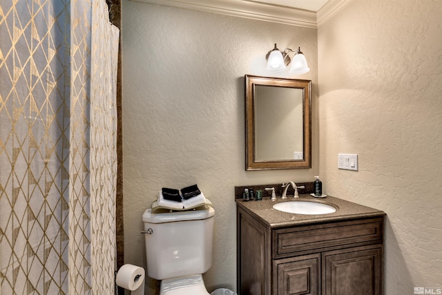 bathroom with ornamental molding, vanity, toilet, and curtained shower