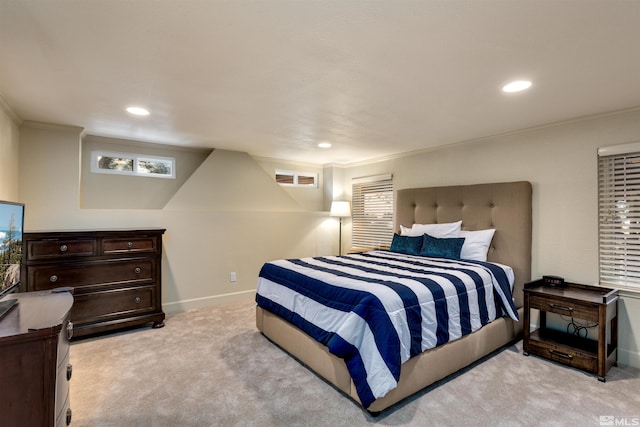 carpeted bedroom with ornamental molding