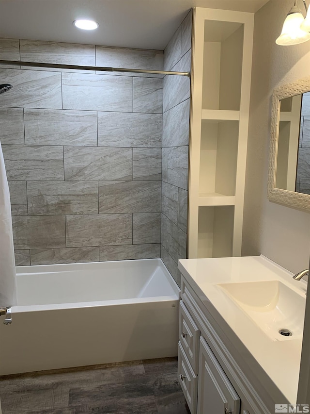 bathroom featuring vanity, hardwood / wood-style floors, and shower / tub combo with curtain