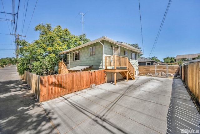 view of side of property with a patio area