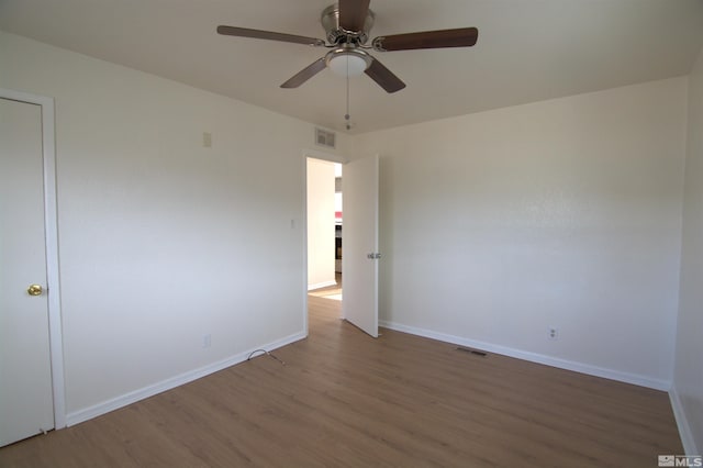 unfurnished room featuring wood-type flooring and ceiling fan