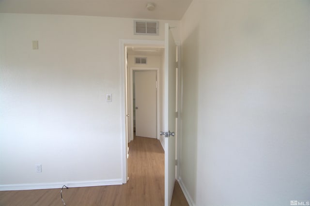 hallway featuring wood-type flooring