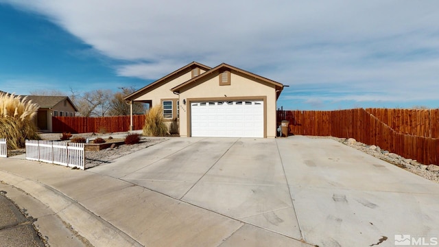 ranch-style house featuring a garage