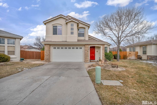 view of property featuring a garage and a front yard