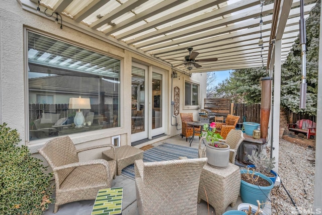 view of patio with ceiling fan and a pergola