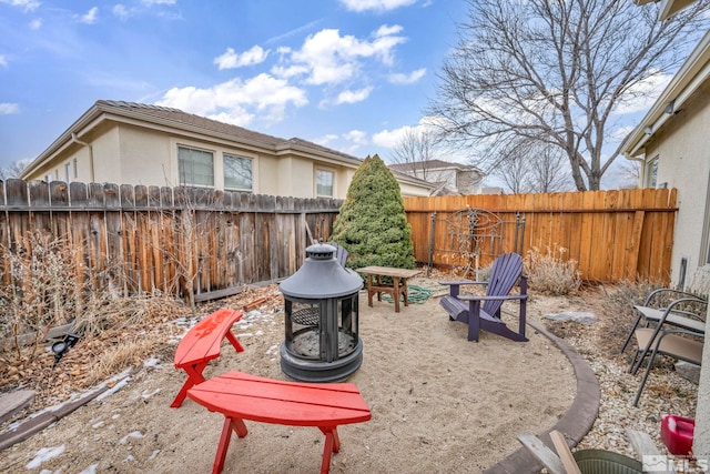 view of yard featuring an outdoor fire pit