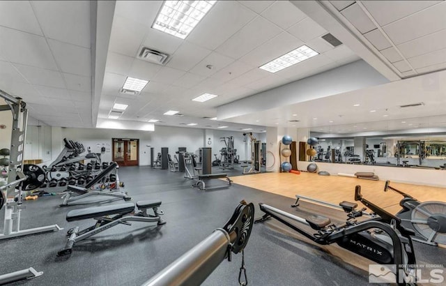 workout area with a drop ceiling