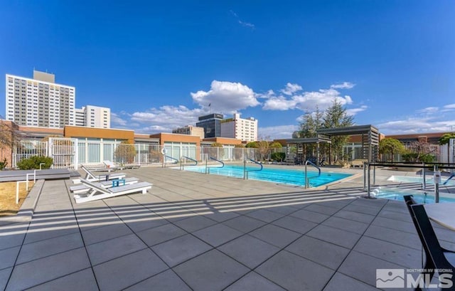 view of swimming pool featuring a patio