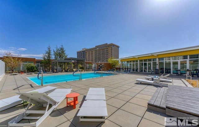 view of pool featuring a patio area