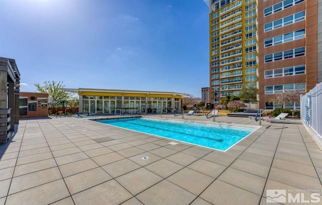 view of swimming pool featuring a patio area