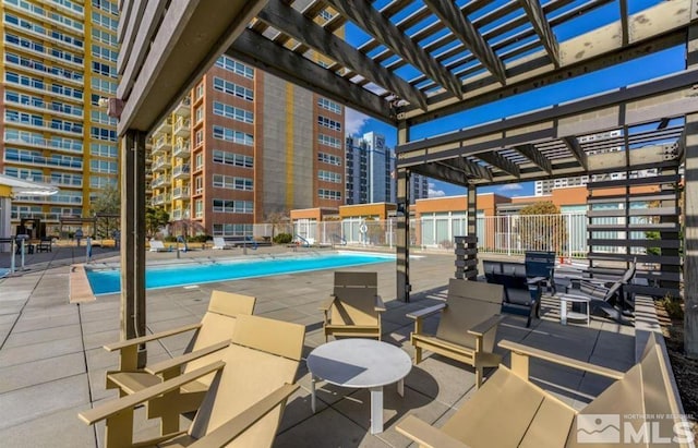 view of pool featuring a pergola and a patio