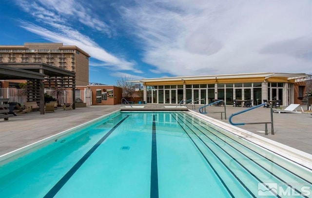 view of swimming pool featuring a patio