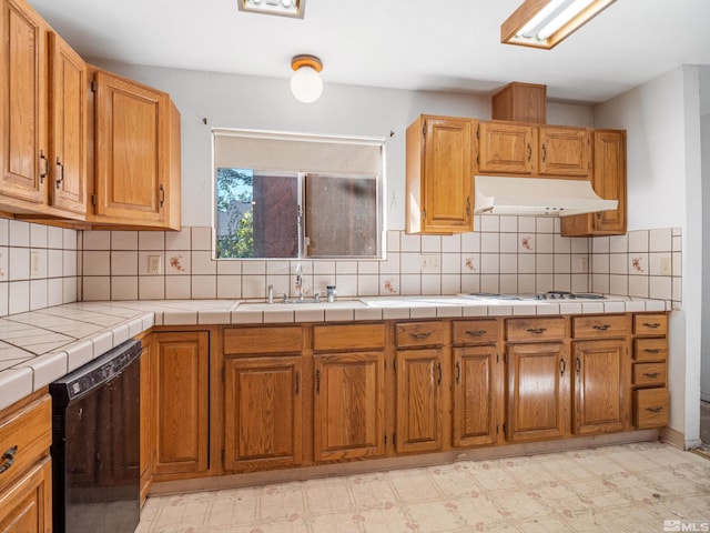 kitchen with white cooktop, dishwasher, tasteful backsplash, and tile countertops