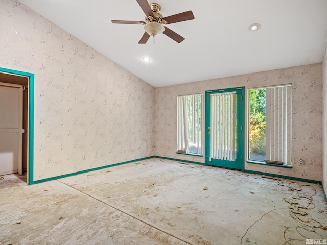 spare room featuring ceiling fan and lofted ceiling